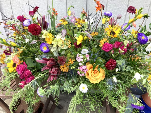 Large sympathy basket of mixed colorful flowers