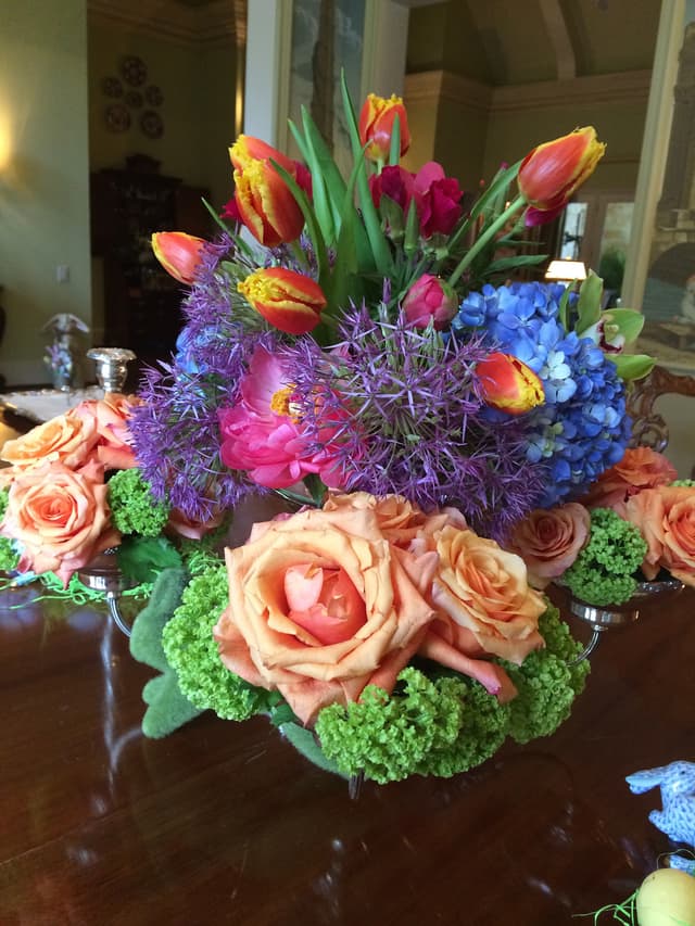 Purple allium and roses with blue hydrangea designed in a bubble bowl