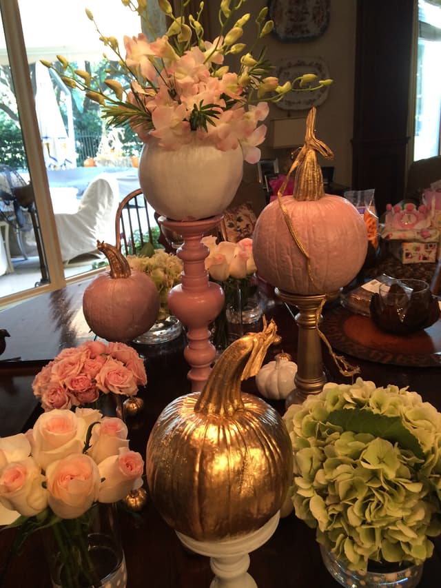 Fall table display of blush pumpkins, roses, and hydrangea