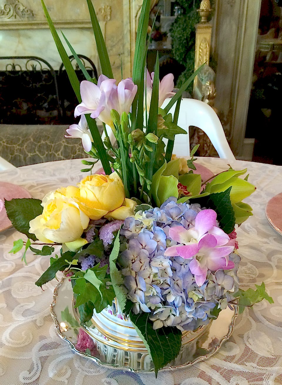Spring party arrangement of peonies, hydrangea, and yellow roses