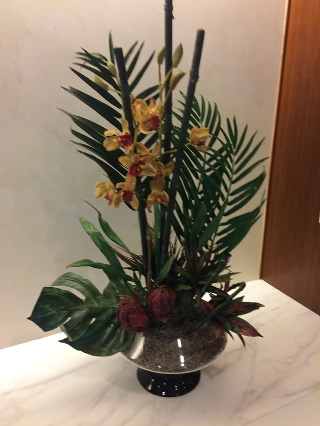 Hawaiian-style silk design with cymbidium orchids and tropical foliage