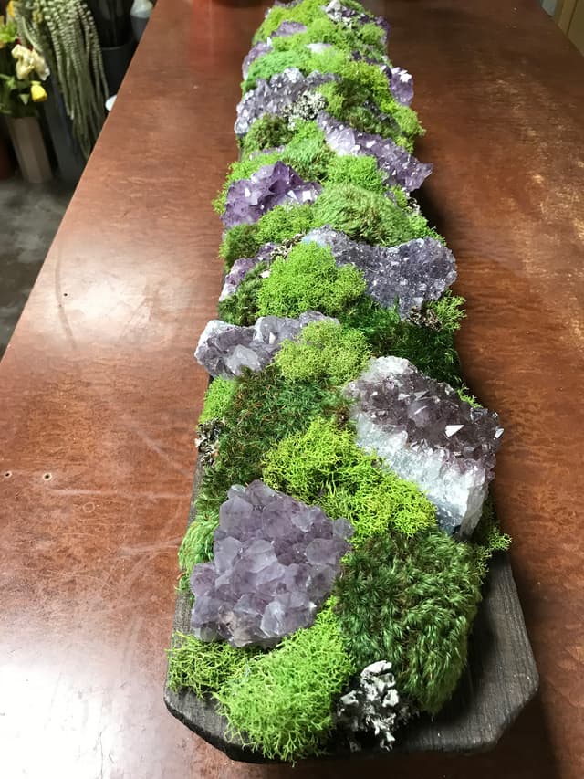 Table runner of green moss with amethyst crystal accents