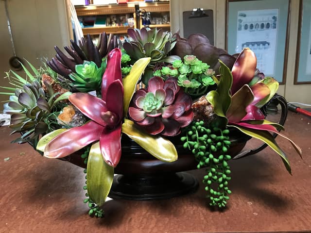 Pavé design of faux succulents studded with geode crystals
