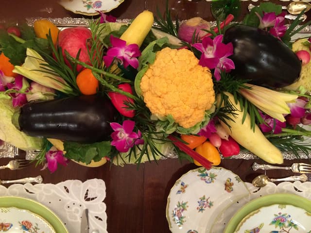 Thanksgiving centerpiece of fresh vegetables and orchids